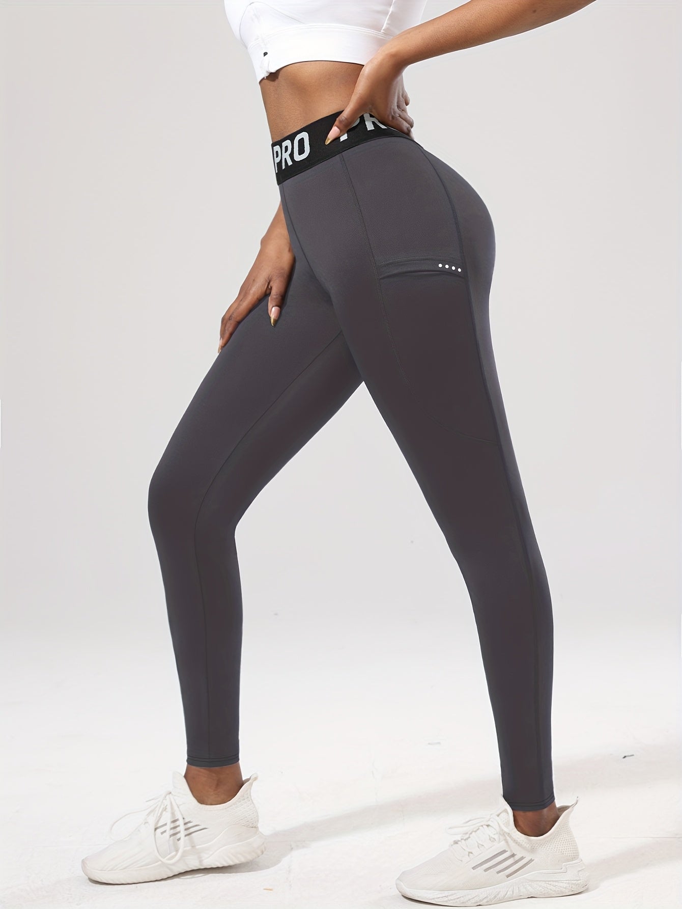 Legging de sport femme taille haute PRO avec poche latérale