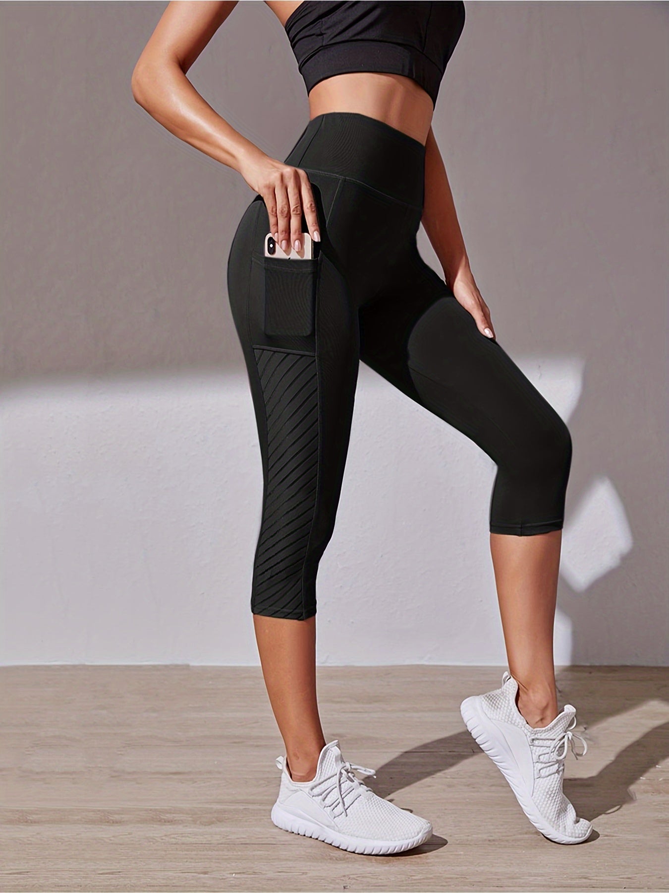 Legging de sport court taille haute avec poche latérale